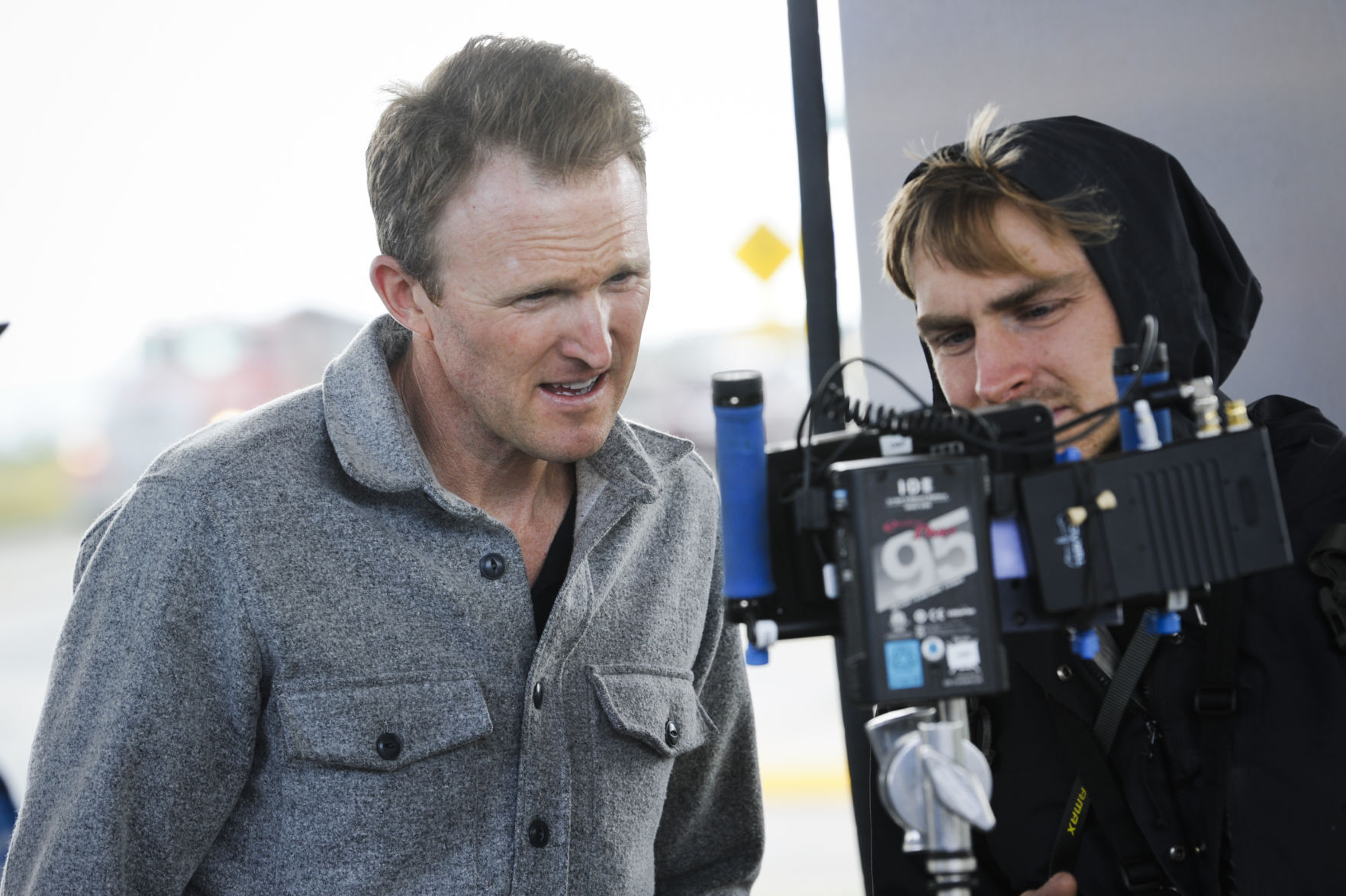 Director Derek Bauer reviews filming